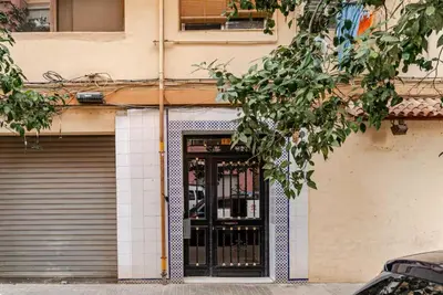 a door to a building with a garage at loft cerca del centro de Valencia in Valencia