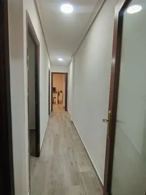 an empty hallway with a hallway leading to a room at Avenida Mediterráneo in Puerto de Sagunto