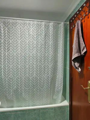 a shower with a shower curtain in a bathroom at Avenida Mediterráneo in Puerto de Sagunto
