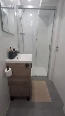 a bathroom with a shower and a white sink at Loft con balcón cercano al centro de Valencia in Valencia