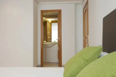 a bathroom with a sink and a mirror at Apartments Serrería II in Valencia