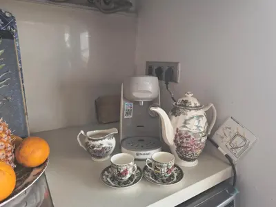 a kitchen counter with cups and a coffee maker at luxury and relax in Valencia