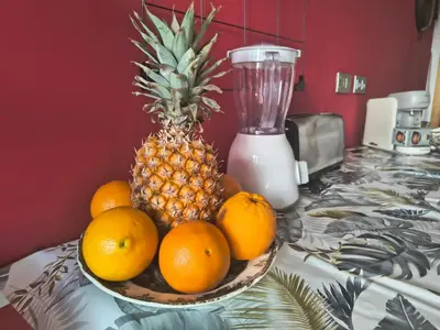 a bowl of fruit on a counter with a pineapple at luxury and relax in Valencia