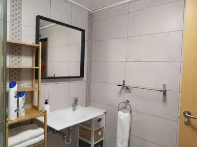 a bathroom with a sink and a mirror at luxury and relax in Valencia
