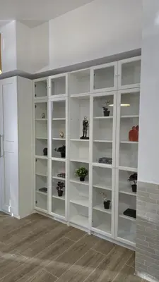 a room with white cabinets with potted plants on them at Apartamentos Vicent Clavel in Valencia
