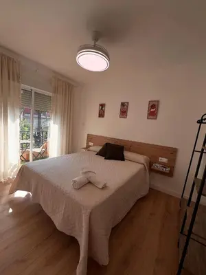 a bedroom with a bed with two towels on it at El Surtidor in Anna