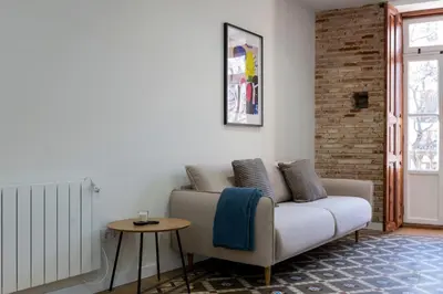a living room with a couch and a table at Quart Historic Stay 2 in Valencia