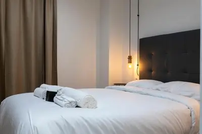 two towels on a bed in a hotel room at Quart Historic Stay 2 in Valencia