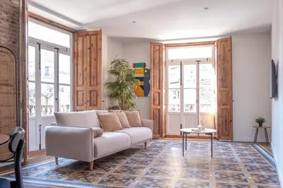 a living room with a couch and a table at Quart Historic Stay 2 in Valencia