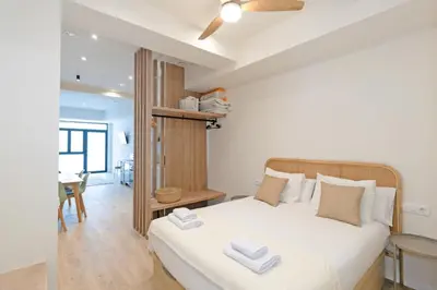 a bedroom with a bed with two towels on it at GuestReady - Charming place in Valencia in Valencia