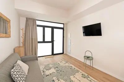 a living room with a couch and a flat screen tv at GuestReady - Charming place in Valencia in Valencia