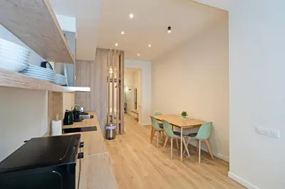 a kitchen and dining room with a table and chairs at GuestReady - Charming place in Valencia in Valencia