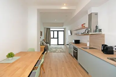 a kitchen with a wooden counter top in a room at GuestReady - Charming place in Valencia in Valencia