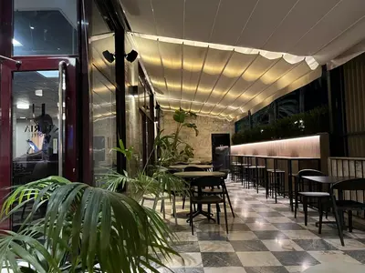 a row of tables and chairs in a restaurant at Hotel Turia Valencia in Valencia