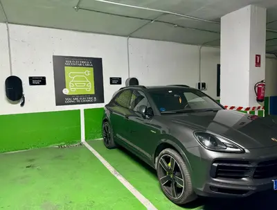 a green car parked in a parking garage at Hotel Turia Valencia in Valencia