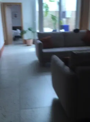 a living room with couches in a living room at Apartamento Cerca las Playa in Valencia
