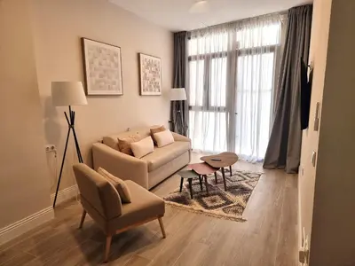 a living room with a couch and a chair at MD Senda del Aire in Valencia