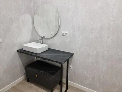 a bathroom with a sink and a mirror on a counter at MD Senda del Aire in Valencia