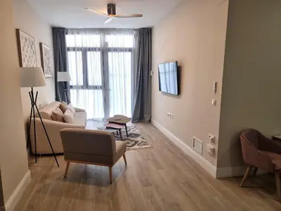 a living room with a couch and a chair at MD Senda del Aire in Valencia