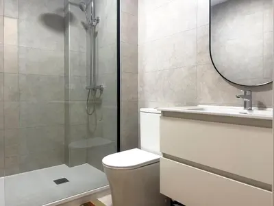a bathroom with a shower and a toilet and a sink at Quart Historic Stay 1 in Valencia