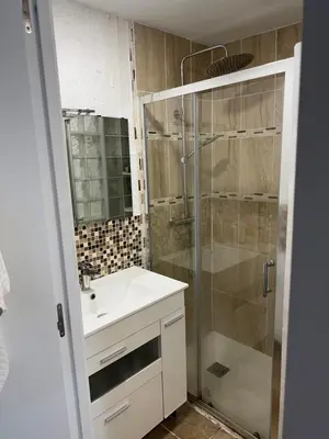 a bathroom with a sink and a shower at Cozy Seaside Apartment in Cullera in Cullera