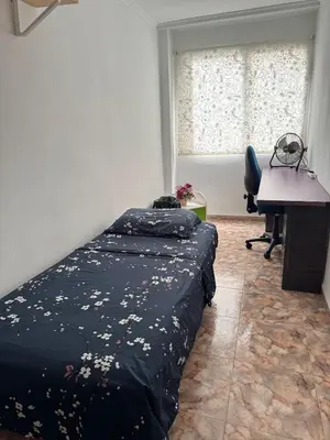 a bedroom with a bed and a desk and a computer at Sweet Stay Valencia in Valencia