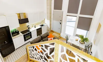 a small kitchen and living room in a apartment at Urban apartment BAJO 6 - HOUSEVANLIVE in Valencia