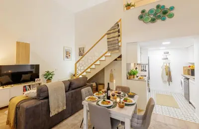 a living room with a couch and a table at Urban apartment BAJO 8 - HOUSEVANLIVE in Valencia