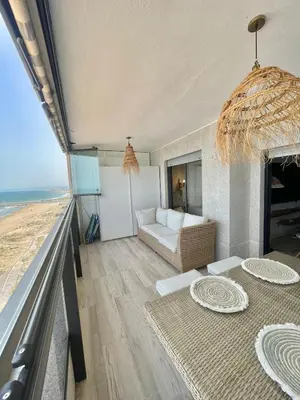 a living room with a view of the ocean at Sobre el mar in Cullera