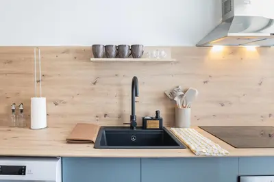 a kitchen with a sink and a counter top at Suite Deluxe Valencia - Beach II Apartments in Valencia
