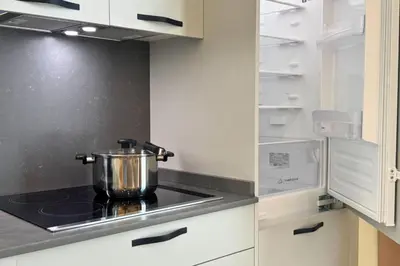 a pot on top of a stove in a kitchen at Illetes Flats - Suite cerca de Feria de Muestras y Metro in Valencia