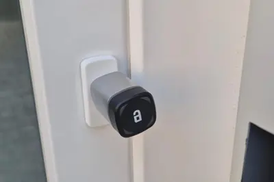 a black and white door lock on a white door at Illetes Flats - Suite cerca de Feria de Muestras y Metro in Valencia