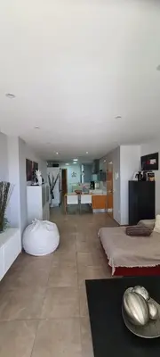 a living room with two beds and a kitchen at Apartment Nules in Nules