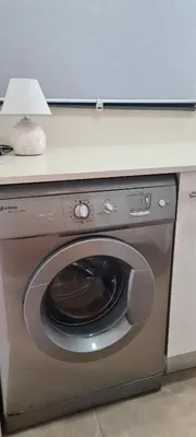 a washing machine with a lamp on top of it at Apartment Nules in Nules