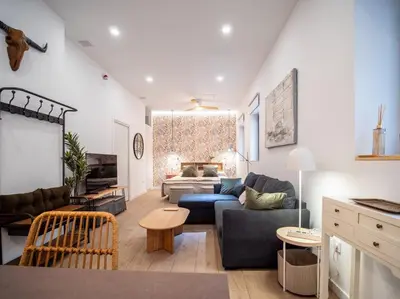 a living room with a couch and a table at Bonito loft para 4 personas in Valencia