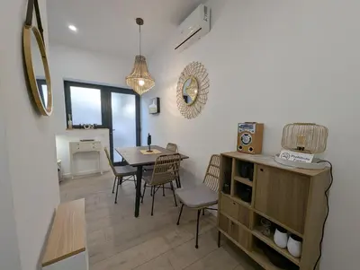 a dining room with a table and chairs in a room at Bonito loft para 4 personas in Valencia