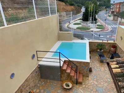 a swimming pool on top of a building at Casa EL CRUCE Navarrés in Navarrés