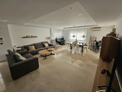 a large living room with a couch and a table at Amazing Villa with swimming pool in Torrent