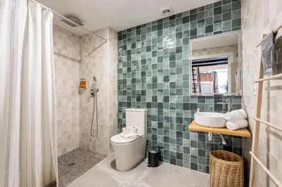 a bathroom with a toilet and a sink and a shower at Lovely duplex on the beach in Valencia