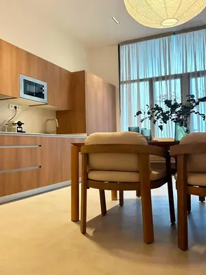 a kitchen with a table and chairs in a room at Pivote Flats-Puerto C in Valencia