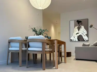 a dining room table and chairs in a living room at Pivote Flats-Puerto C in Valencia