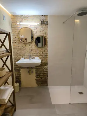 a bathroom with a sink and a mirror at Apartment next to the Marina De Valencia in Valencia