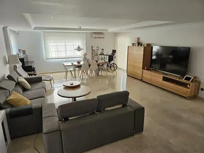a living room with a couch and a flat screen tv at Amazing Villa with swimming pool in El Vedat de Torrente in Torrent
