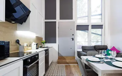a kitchen with a table and a dining room at Urban apartment 4 BAJO - Housevanlive in Valencia