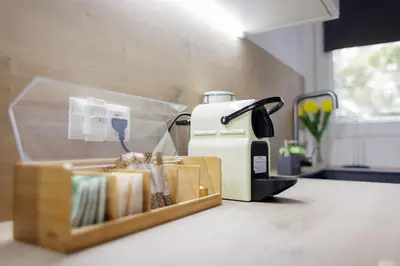 a toaster sitting on top of a counter next to a box at Urban apartment 4 BAJO - Housevanlive in Valencia