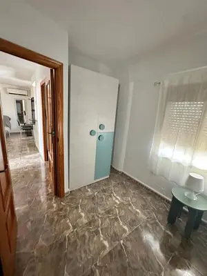 a room with a door and a tile floor at Apartamento edificio JUMAR in Cullera