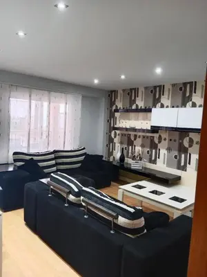 a living room with a couch and a table at Nules Beach Apartment in Moncófar