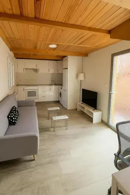 a living room with a couch and a tv at Duplex Miguelete tower & 4th FLOOR and NO elevator in Valencia