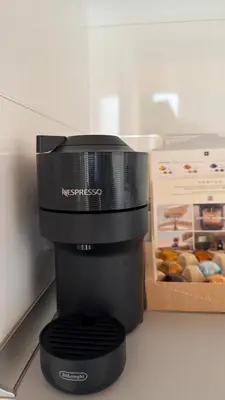 a coffee maker sitting on a counter next to a box at Duplex Miguelete tower & 4th FLOOR and NO elevator in Valencia