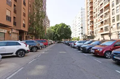 a row of parked cars on a city street at GuestReady - Lovely stay in the Algirós area in Valencia